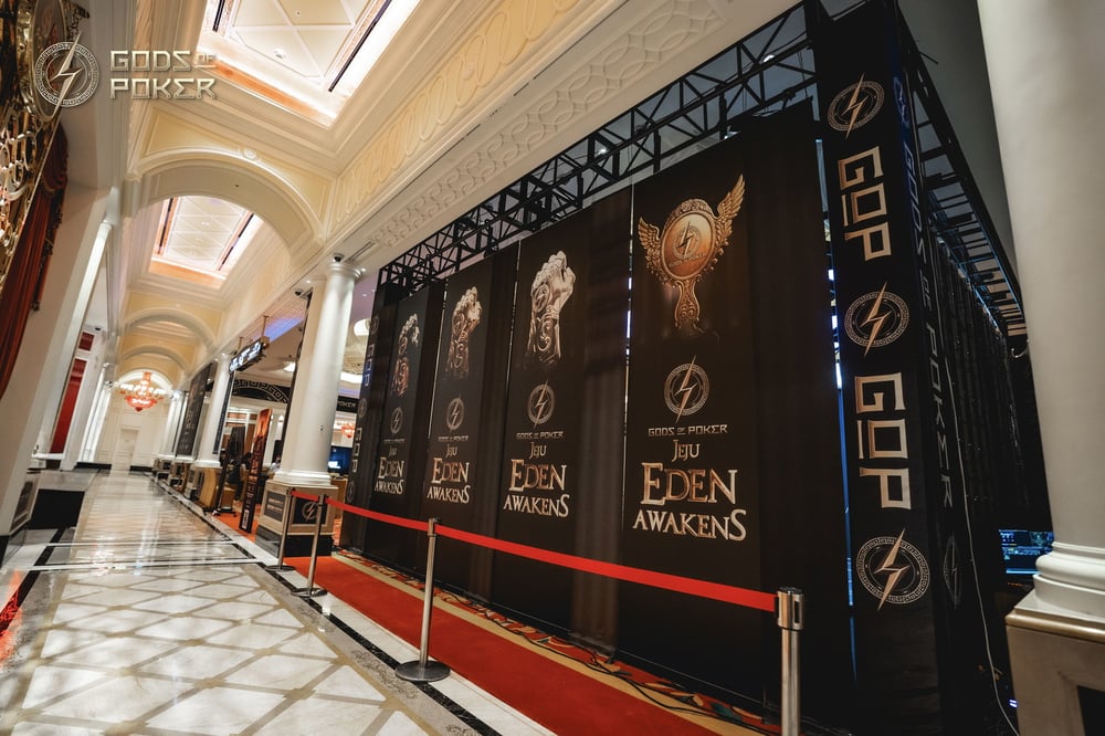 A luxurious hallway features large black banners for "EDEN AWAKENS" event and a red carpet.